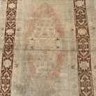 1970s brown Turkish handknotted rug with traditional design, hand-knotted weave and low pile.