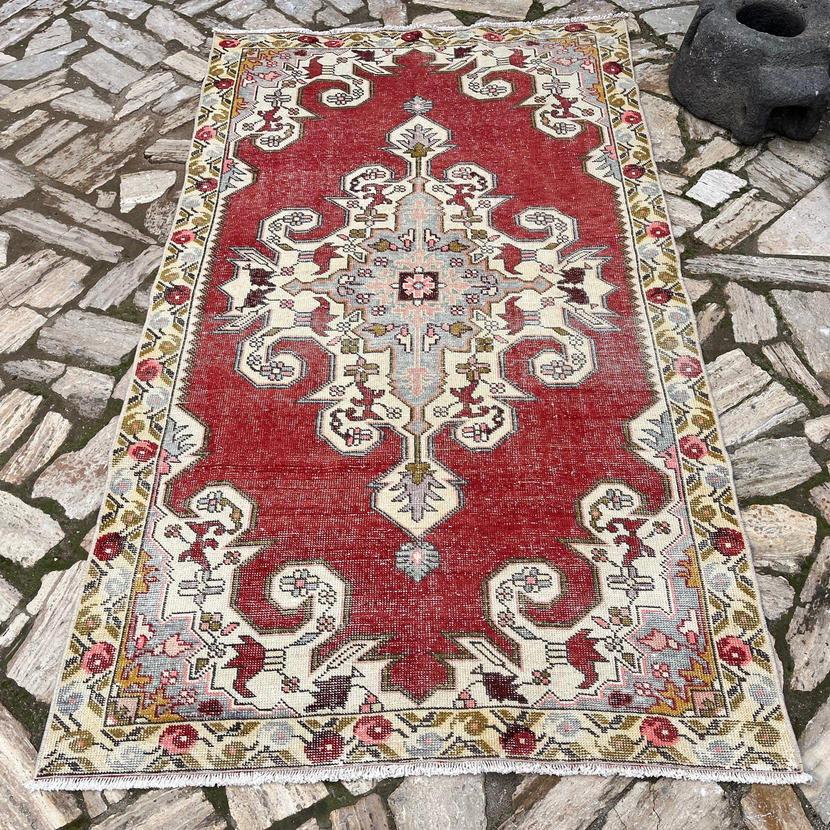 Red 4' x 7' Turkish handknotted rug in wool and cotton, shown on the floor.