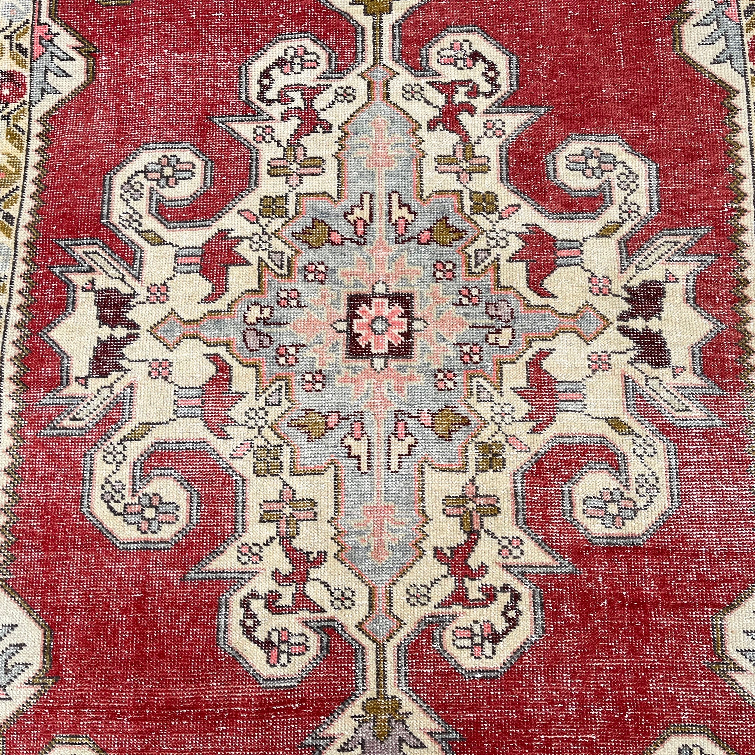 1970s red Turkish handknotted rug with traditional design, hand-knotted weave and low pile.