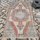 Red 4' x 7' Turkish handknotted rug in wool and cotton, shown on the floor.