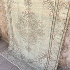 1970s pale green Turkish handknotted rug with medallion design, hand-knotted weave and low pile.