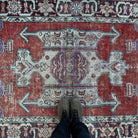 1970s purple Turkish handknotted rug with geometric design, hand-knotted weave and low pile.