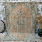 Orange 6' x 9' handknotted rug with medallion design, handmade in Turkey – Eugene.