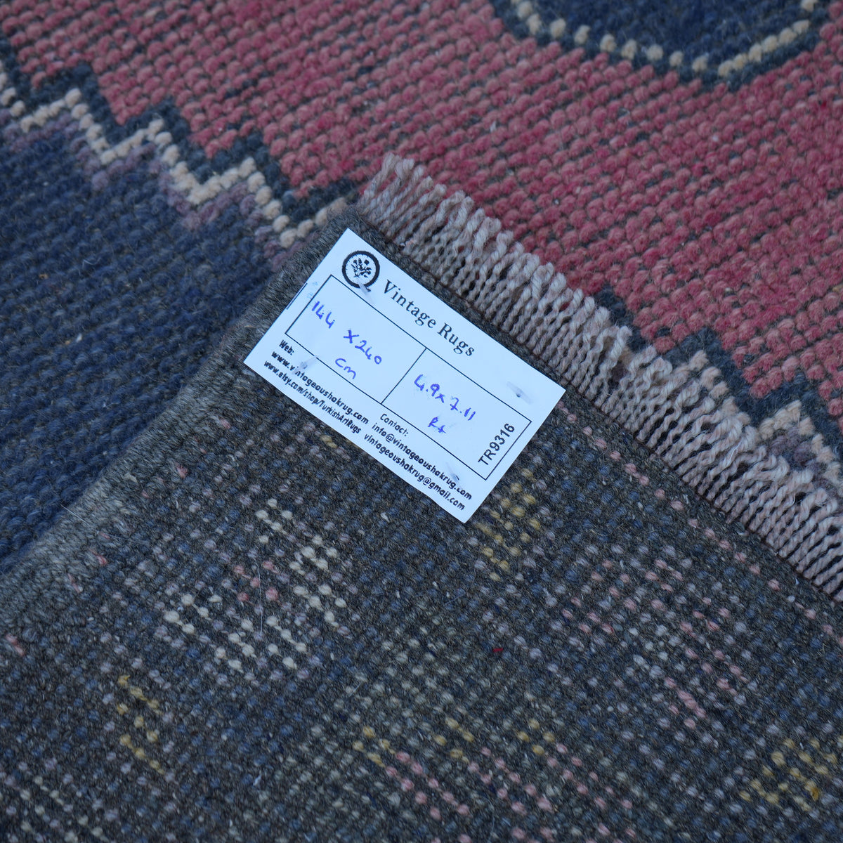 Pink 5' x 8' handknotted turkish rug from the 1970s with traditional design.