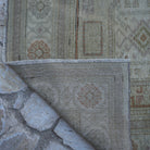 1970s beige Turkish handknotted vintage rug with neutral design, hand-knotted weave and low pile.