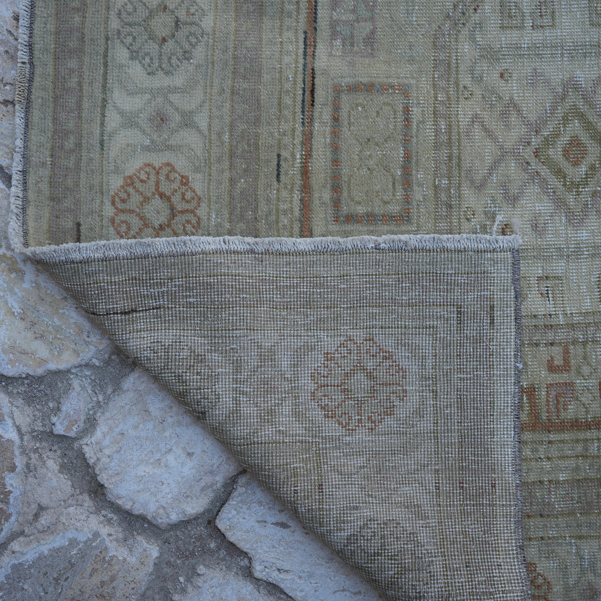 1970s beige Turkish handknotted vintage rug with neutral design, hand-knotted weave and low pile.