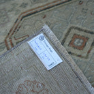 Beige 5' x 8' Turkish handknotted vintage rug from the 1970s with neutral design.