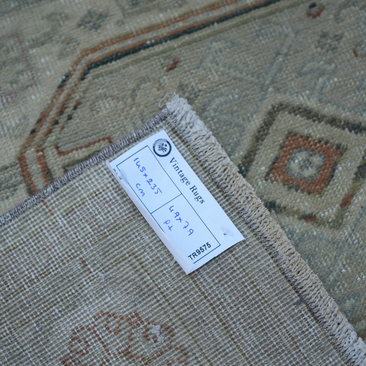 Beige 5' x 8' Turkish handknotted vintage rug from the 1970s with neutral design.