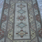 Close-up of the beige Turkish handknotted wool rug showing traditional details, hand-knotted weave, wool and low pile.