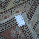 Beige 5' x 8' Turkish handknotted wool rug from the 1970s with traditional design.