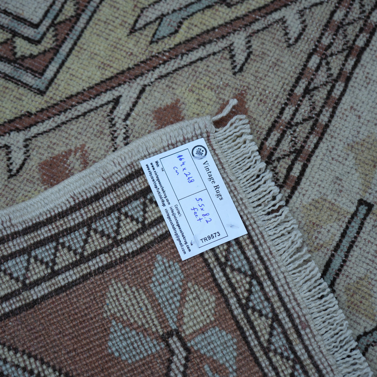 Beige 5' x 8' Turkish handknotted wool rug from the 1970s with traditional design.