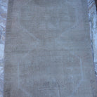 Close-up of the beige Turkish handmade neutral rug showing neutral details, hand-knotted weave, wool and cotton and low pile.