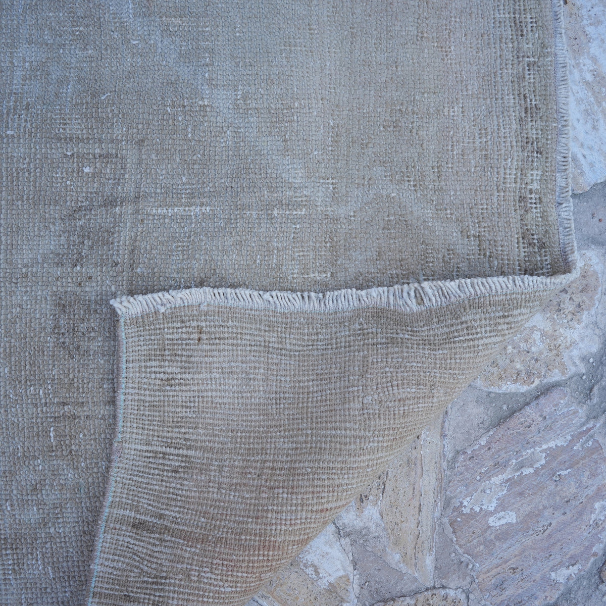 1970s beige Turkish handmade neutral rug with neutral design, hand-knotted weave and low pile.