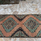 1970s orange Turkish handmade oushak runner rug with oushak design, hand-knotted weave and low pile.