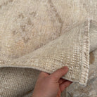 Close-up of the beige Turkish handmade runner rug showing neutral details, hand-knotted weave, wool and cotton and low pile.
