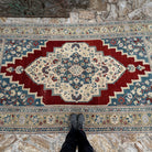 1970s red Turkish handmade traditinoal rug with traditional design, hand-knotted weave and low pile.