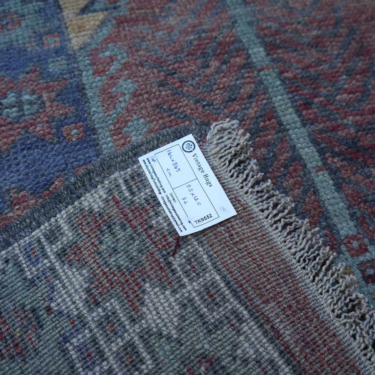 Colorful 5' x 12' Turkish handmade vintage carpet from the 1970s with traditional design.