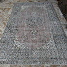 Blue 6' x 10' Turkish handmade vintage wool rug in wool and cotton, shown on the floor.