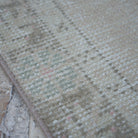 Beige 3' x 9' Turkish handwoven runner rug in wool and cotton, shown on the floor.