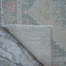 1970s beige Turkish handwoven runner rug with traditional design, hand-knotted weave and low pile.