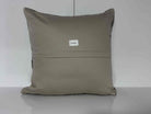 Close-up of the gray Turkish kilim pillow showing traditional details.