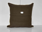 Close-up of the beige Turkish kilim pillow showing striped details.