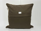 Close-up of the beige Turkish kilim pillow showing striped details.