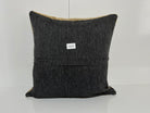 Close-up of the beige Turkish kilim pillow showing geometric details.