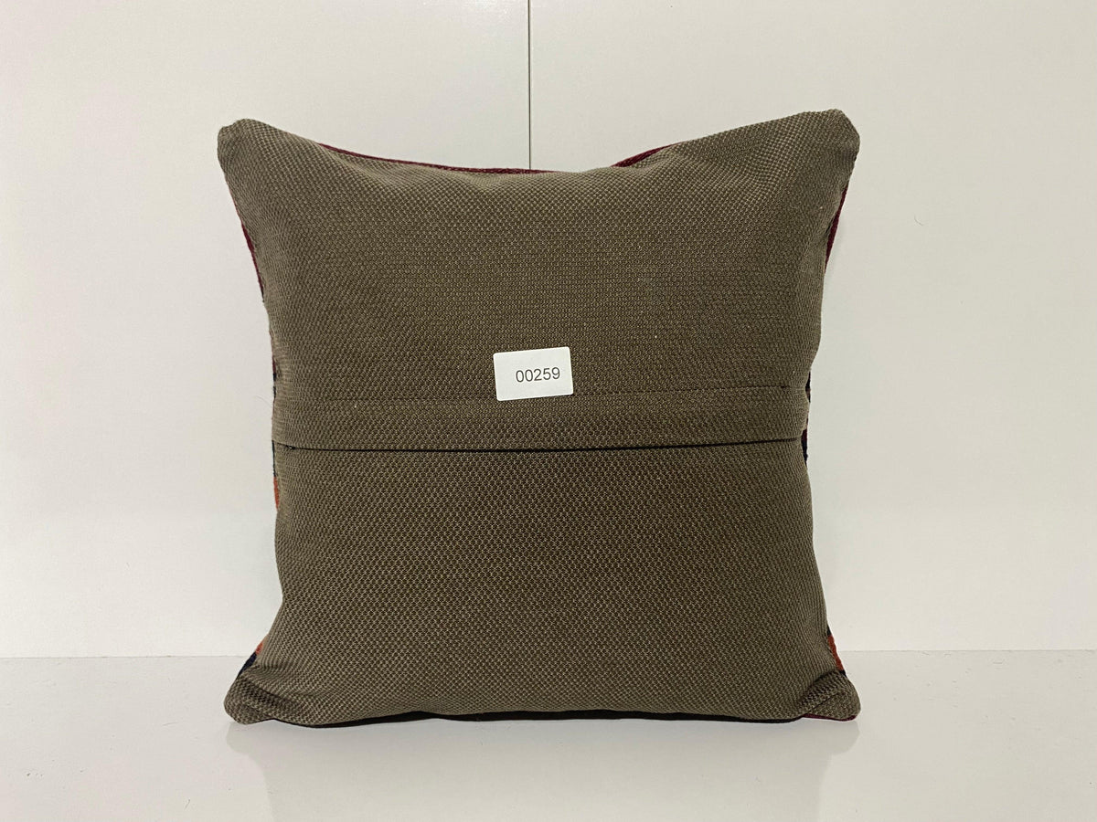 Close-up of the black Turkish kilim pillow showing striped details.