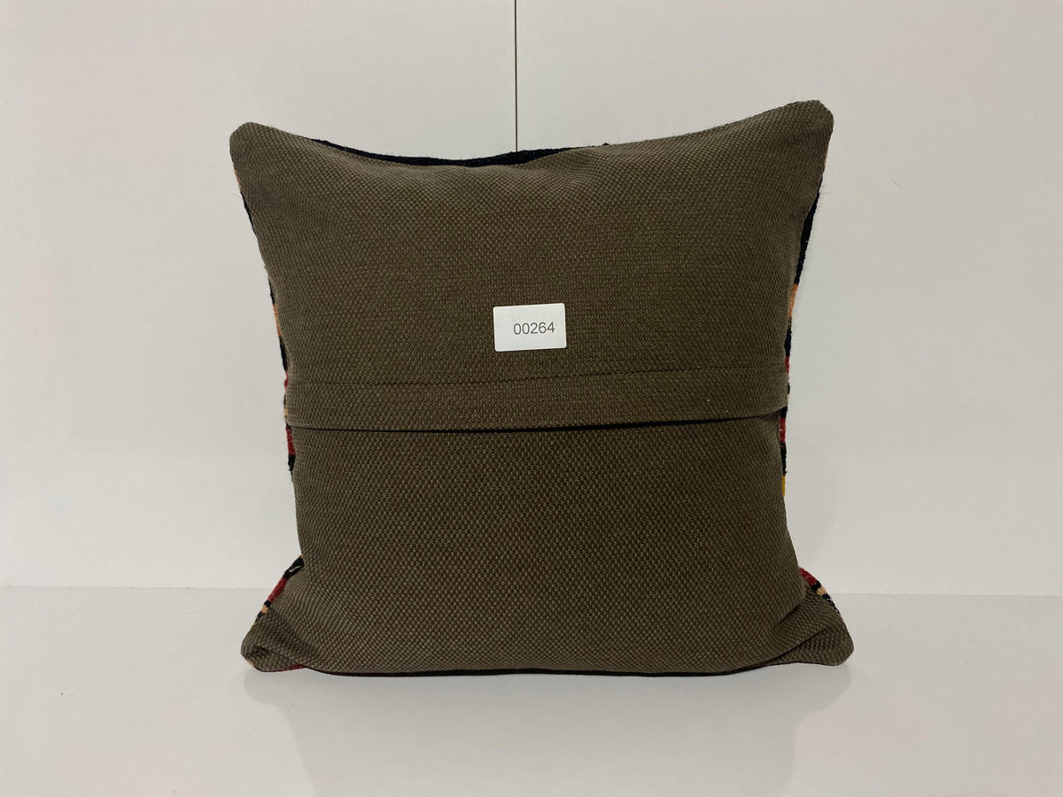 Close-up of the black Turkish kilim pillow showing striped details.