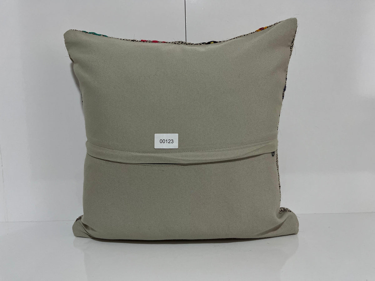 Close-up of the gray Turkish kilim pillow showing traditional details.