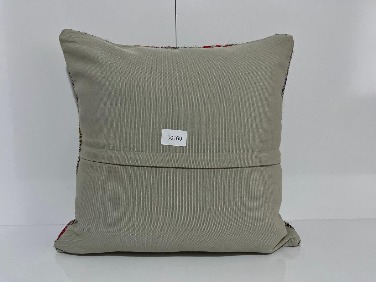 Close-up of the gray Turkish kilim pillow showing traditional details.