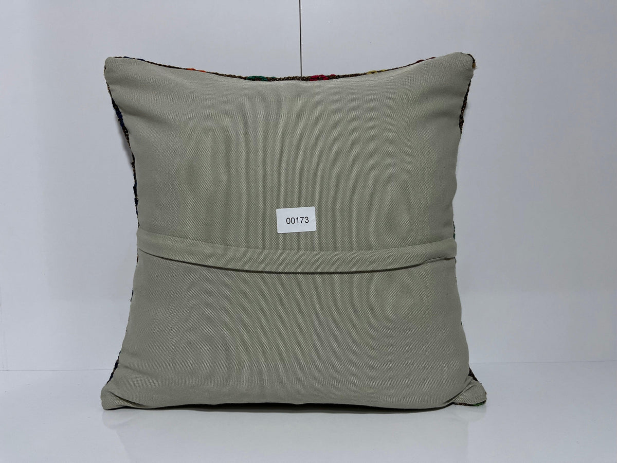 Close-up of the gray Turkish kilim pillow showing traditional details.
