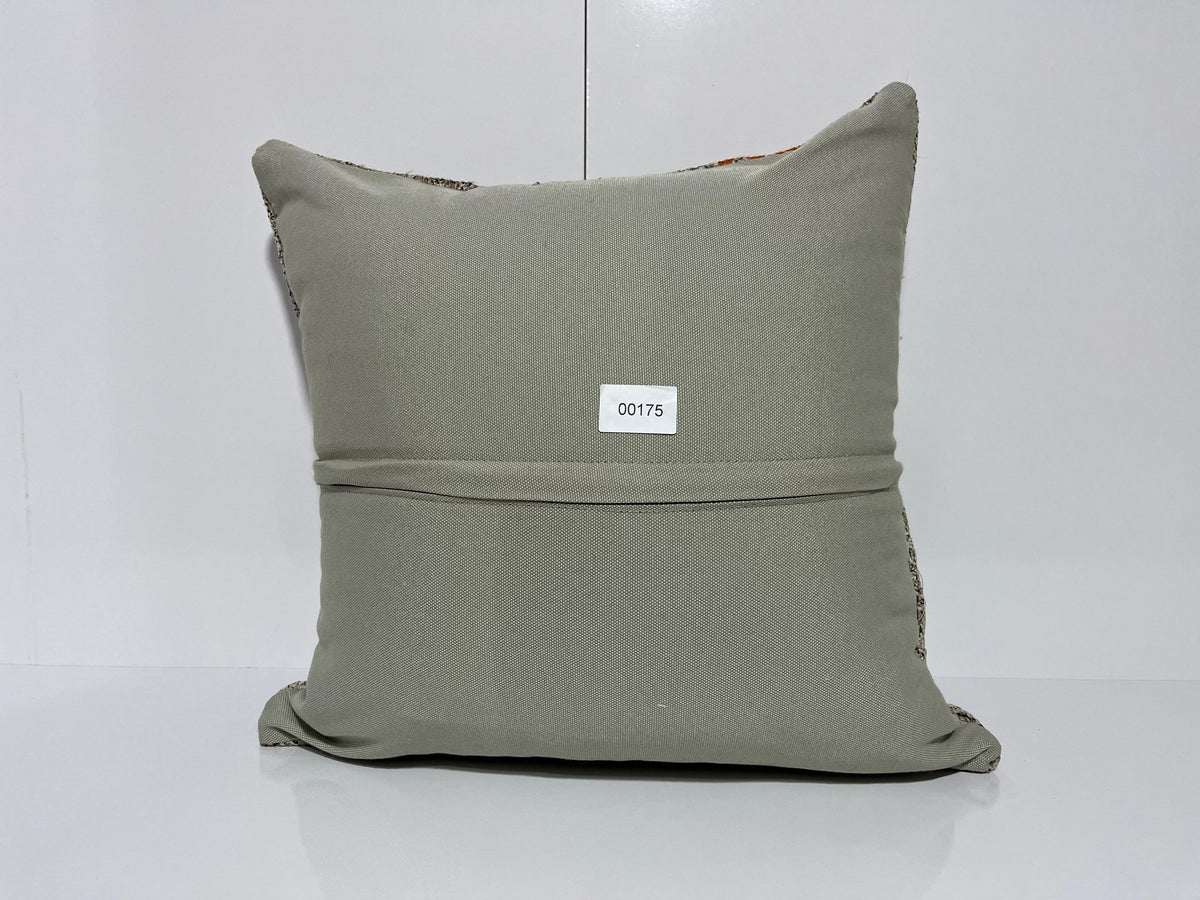 Close-up of the gray Turkish kilim pillow showing traditional details.