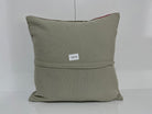 Close-up of the gray Turkish kilim pillow showing traditional details.