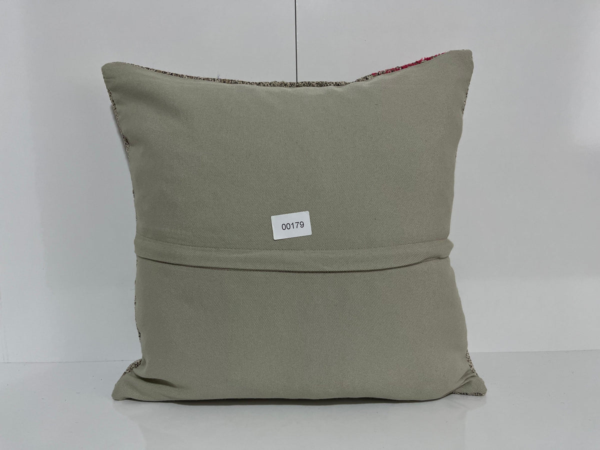 Close-up of the gray Turkish kilim pillow showing traditional details.