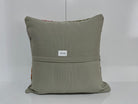 Close-up of the gray Turkish kilim pillow showing traditional details.