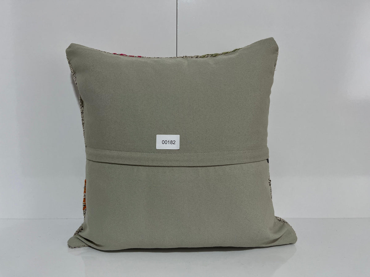Close-up of the gray Turkish kilim pillow showing traditional details.