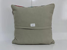 Close-up of the gray Turkish kilim pillow showing traditional details.