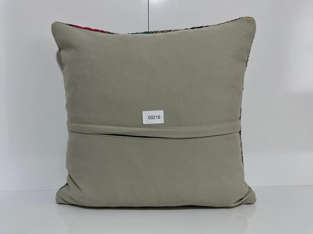 Close-up of the gray Turkish kilim pillow showing traditional details.