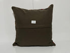 Close-up of the gray Turkish kilim pillow showing traditional details.