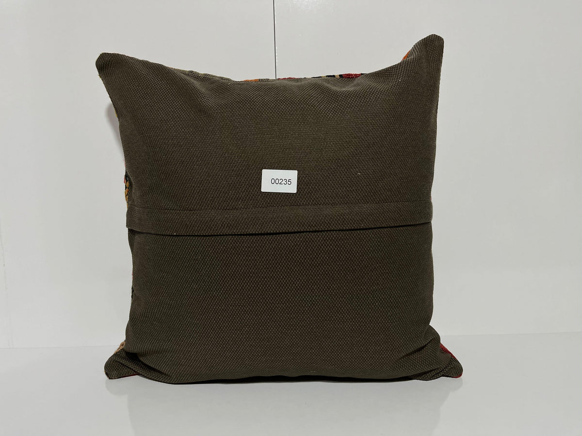 Close-up of the gray Turkish kilim pillow showing traditional details.
