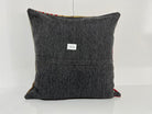 Close-up of the yellow Turkish kilim pillow showing traditional details.