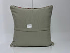Close-up of the gray Turkish kilim pillows showing traditional details.