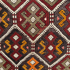 Orange 2' x 4' Turkish kilim rug in wool and cotton, shown on the floor.