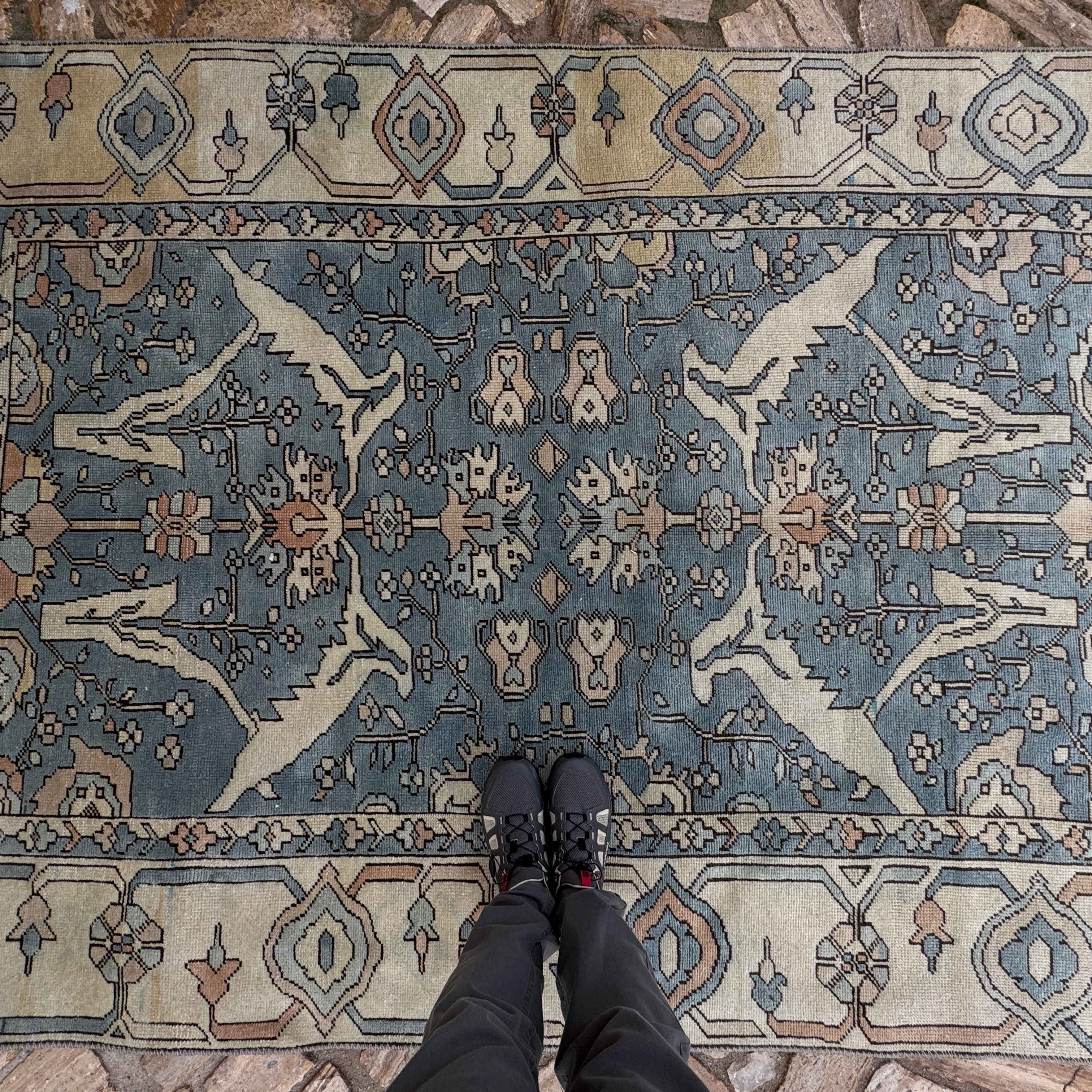 1970s pale blue Turkish large area rug with traditional design, hand-knotted weave and low pile.
