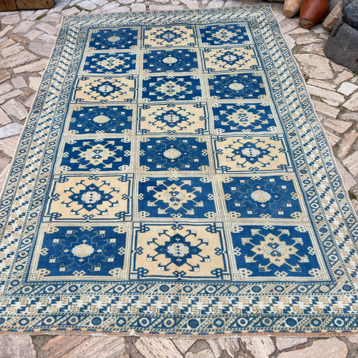 Blue 6' x 9' large turkish rug in wool and cotton, shown on the floor.