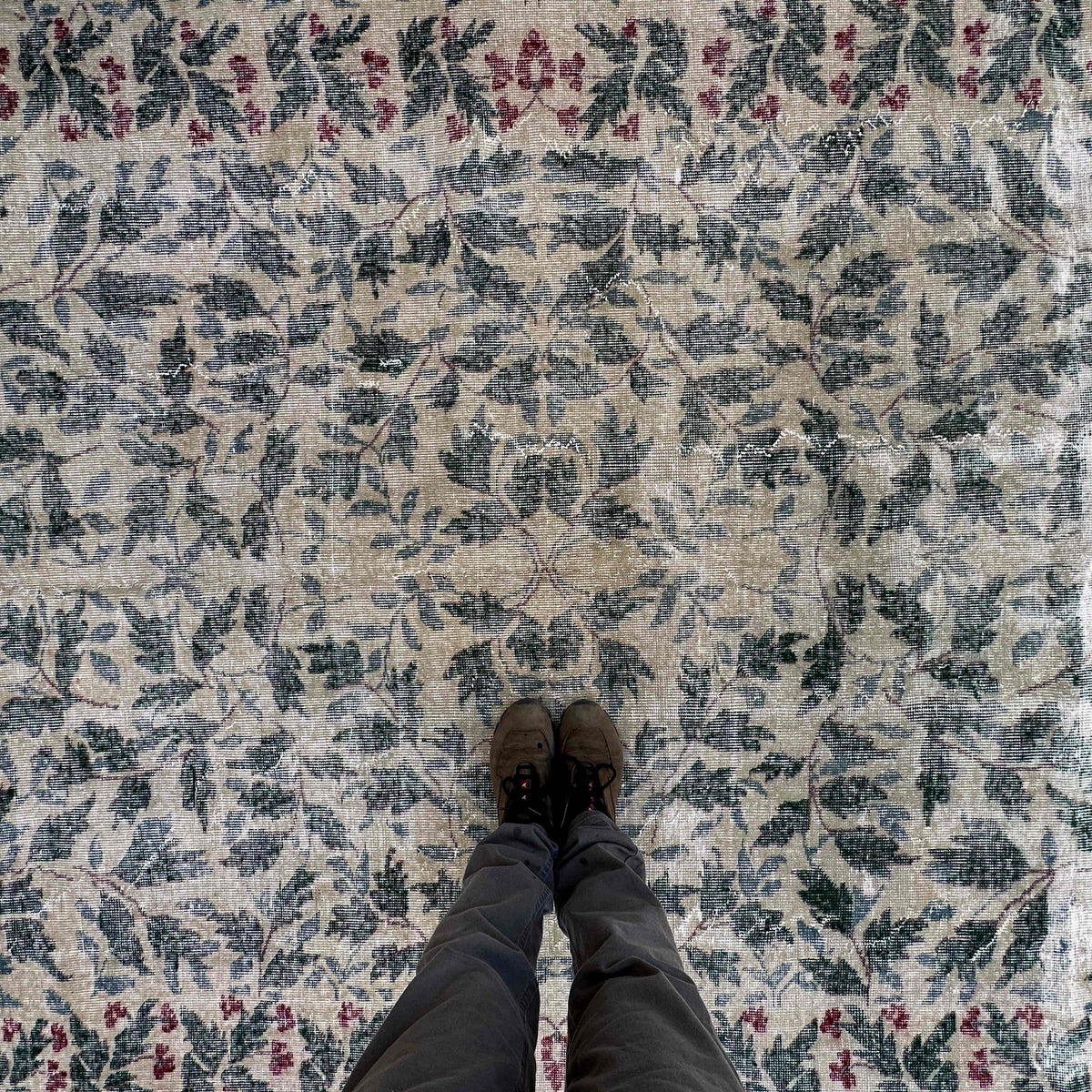 1970s green large turkish rug with floral design, hand-knotted weave and low pile.
