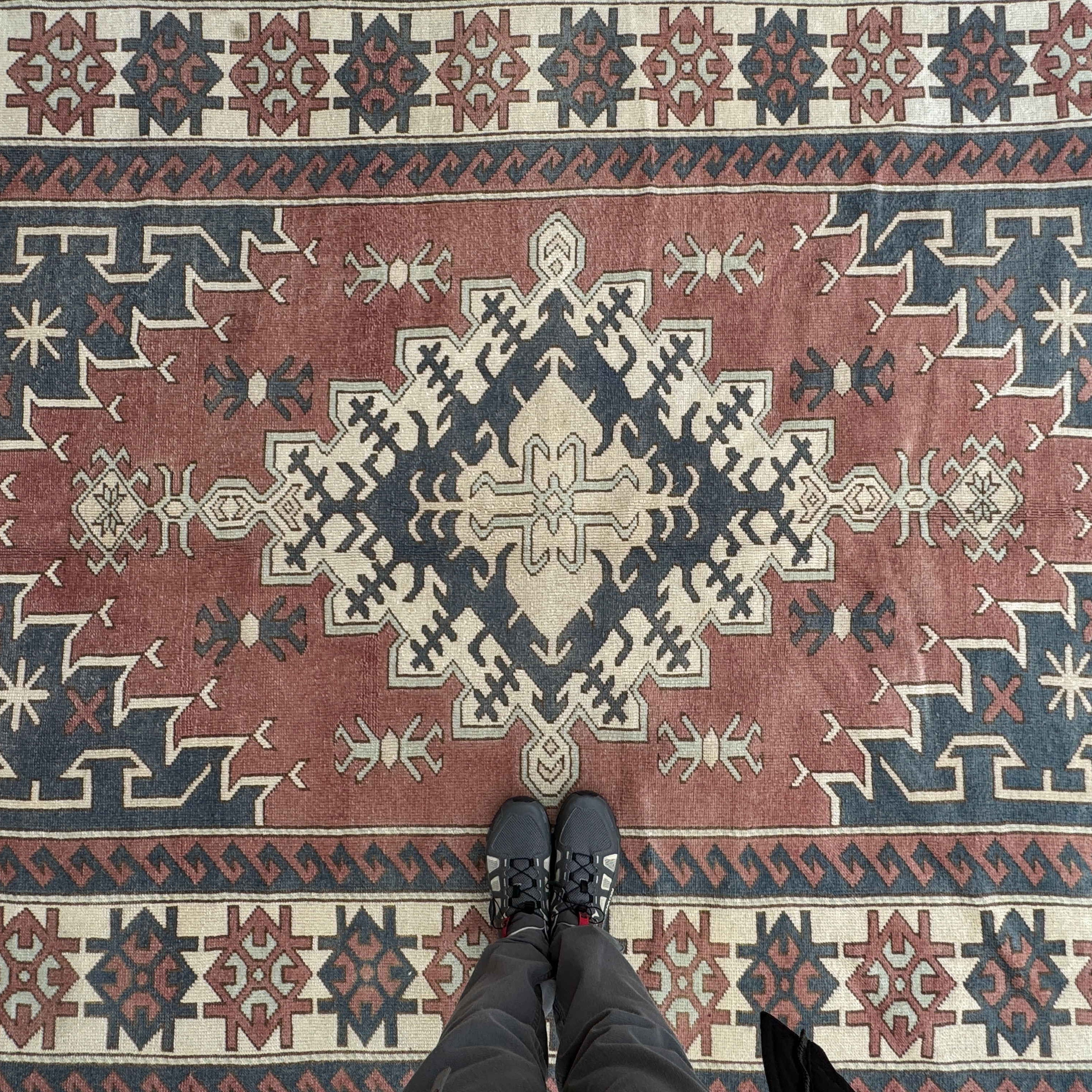 1970s pale pink large turkish rug with traditional design, hand-knotted weave and low pile.