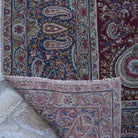 Additional view of the burgundy large vintage persian rug, hand-knotted in wool and cotton.